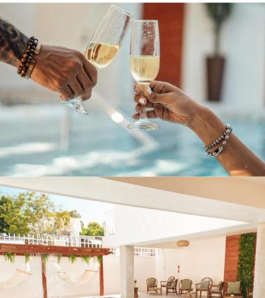 Pareja brindando con champagne junto a la piscina del Nautilus by La Jamaca Hotels en La Parguera