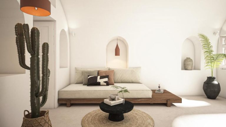 Salón con sofá bajo y decoración mediterránea en blanco en You and Me Suites Oia, Santorini
