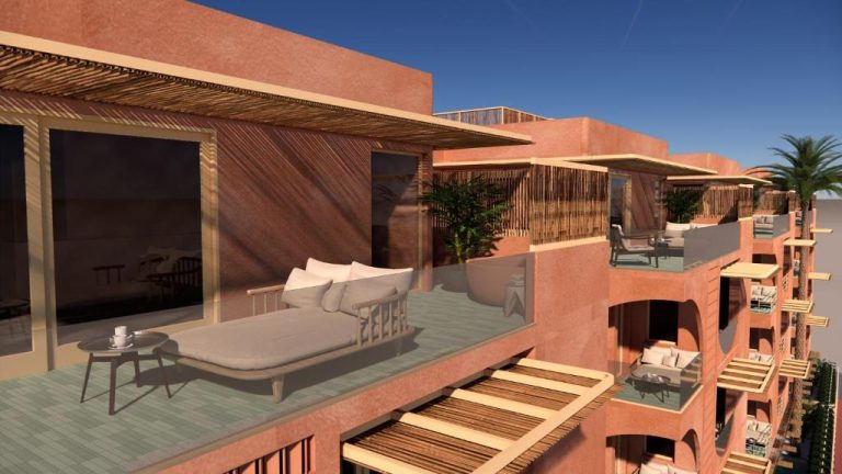 Terraza privada con sofá y tumbonas en el hotel La Gaia Adult Only con vistas al mar