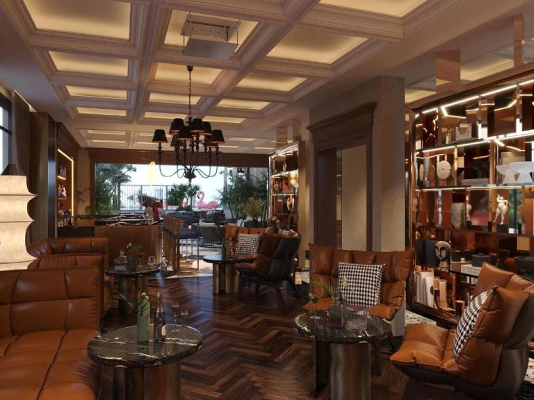 Elegante lobby bar con sofás de cuero y estanterías decorativas del Grand Hotel du Lac Boutique Saigon