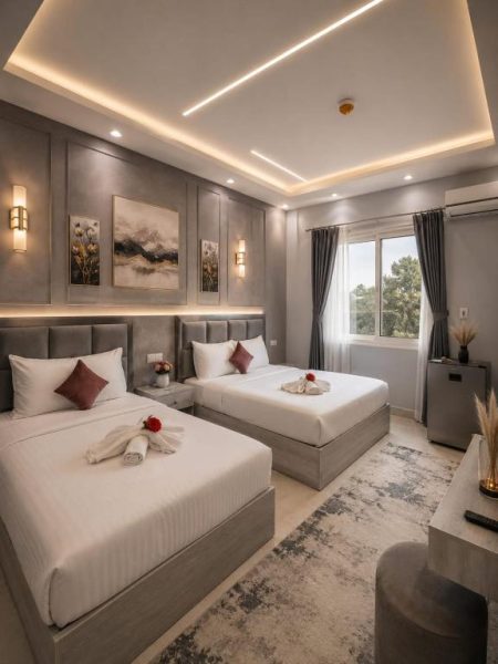 Habitación twin de lujo con dos camas y decoración moderna en Garden Hotel El Tahrir Downtown