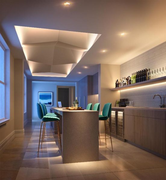 Bar privado con isla central, taburetes turquesa e iluminación de diseño en Spicers Potts Point