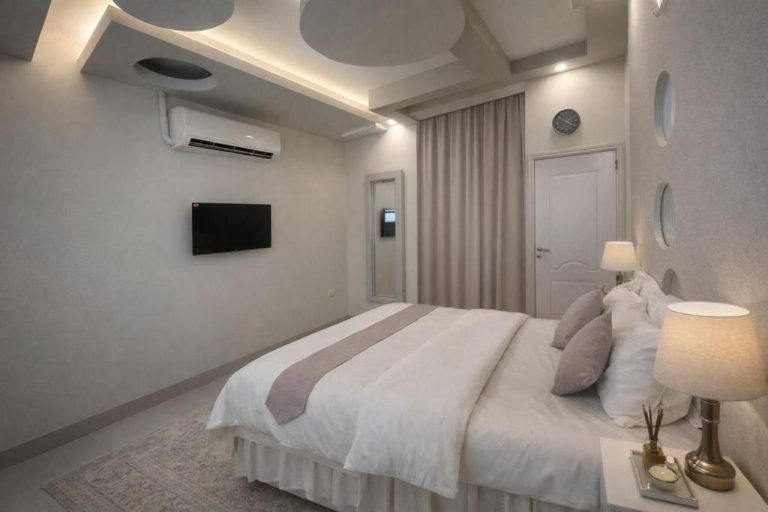 Habitación doble de lujo con cama king size y diseño moderno en Al-Bayraha Hotel Apartments