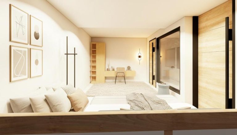 Habitación moderna con escritorio y baño en suite del Hotel 28 Cancún, estilo minimalista