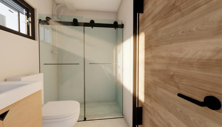 Baño moderno con ducha de cristal deslizante y puerta de madera en Hotel 28 Cancun