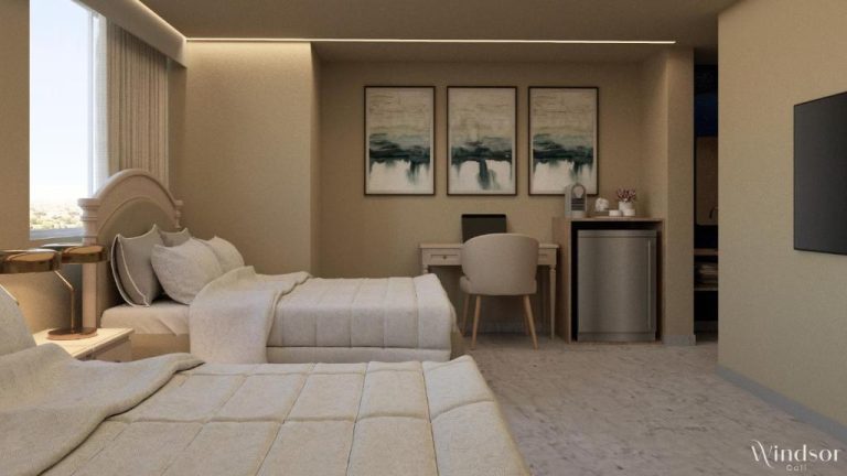 Habitación doble con dos camas, escritorio y minibar en el Hotel Windsor Cali