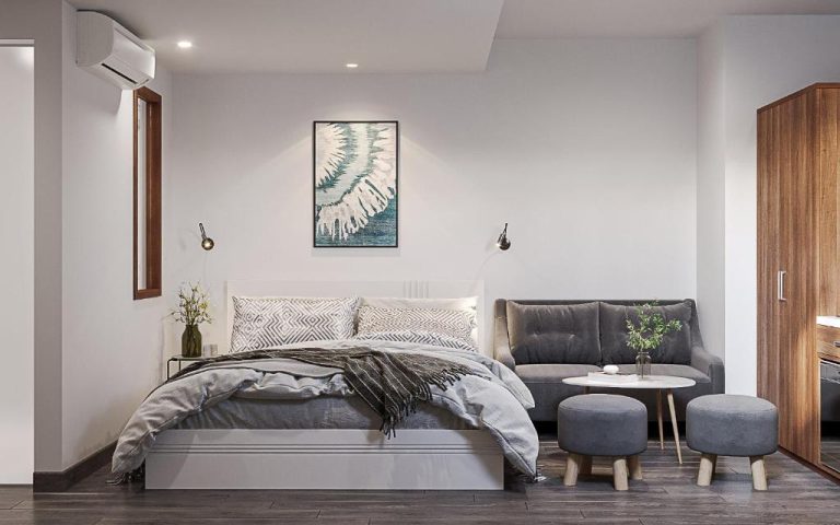 Habitación doble moderna con sofá gris y decoración minimalista en Kas Zody Boutique Hotel & Spa